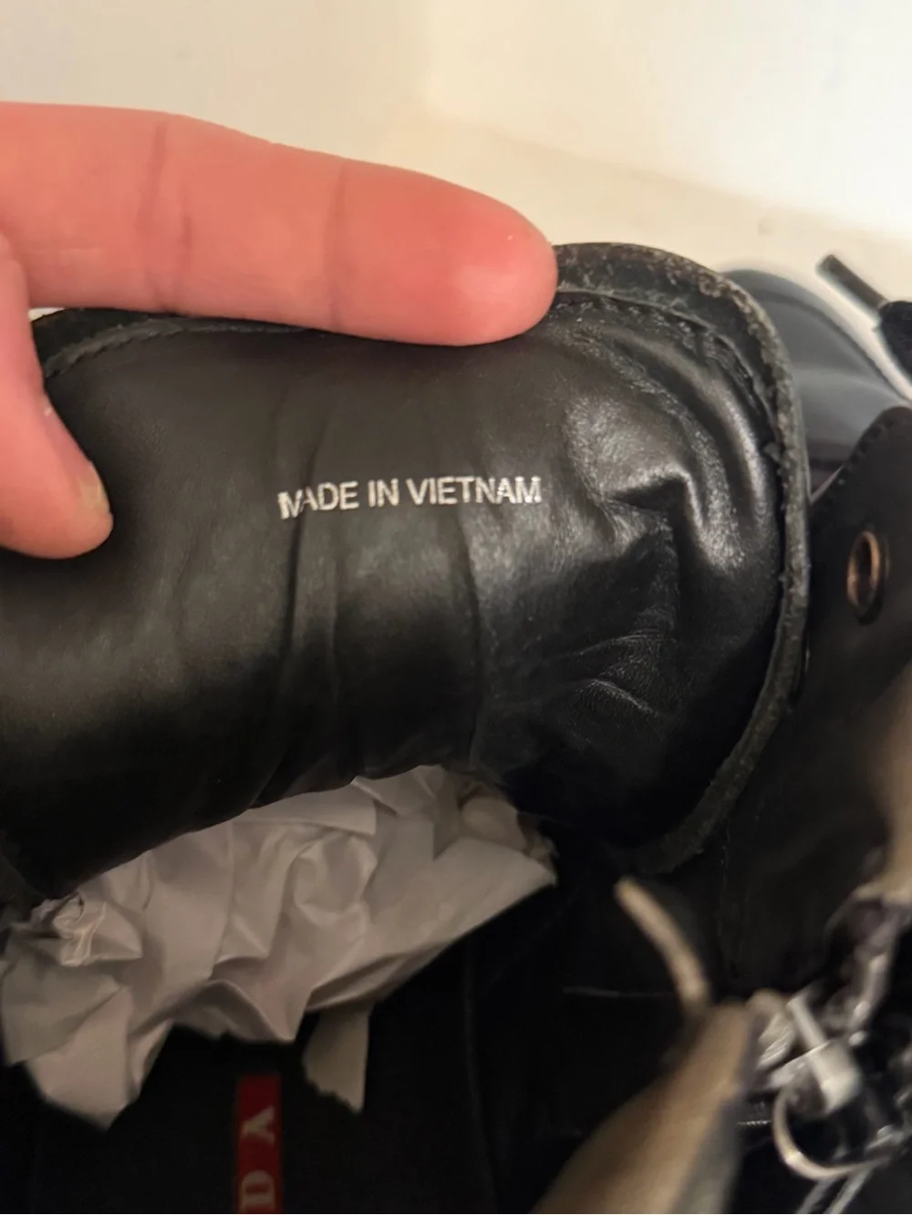 Authentic Prada Black High-Top Leather Sneakers with Red Logo